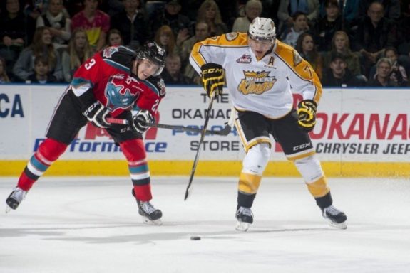 (Marissa Baecker/www.shootthebreeze.ca) Brandon Wheat Kings defenceman Eric Roy, right, lugs the puck up the ice as Kelowna Rockets forward Justin Kirkland gives chase during WHL regular-season action on Oct. 25 in Kelowna.