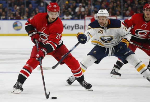 Buffalo Sabres forward Zemgus Girgensons and Carolina Hurricanes forward Sebastian Aho