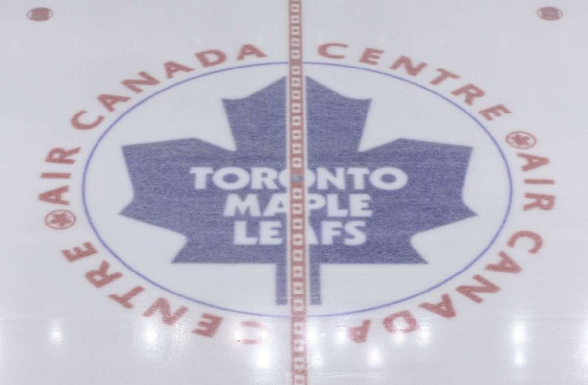 The Toronto Maple Leafs logo at center ice