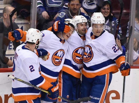 Islanders forward Mathew Barzal (13) and forward Anders Lee