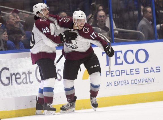 Colorado Avalanche's Samuel Girard celebrates with Tyson Jost the first goal of Jost's hat trick.