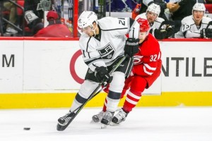 Los Angeles Kings center Nick Shore (21) and Carolina Hurricanes right wing Kris Versteeg (32) during the NHL game between the Los Angeles Kings and the Carolina Hurricanes at the PNC Arena.