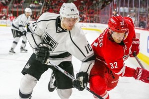 Los Angeles Kings defenseman Christian Ehrhoff (10) and Carolina Hurricanes right wing Kris Versteeg (32) during the NHL game between the Los Angeles Kings and the Carolina Hurricanes at the PNC Arena.