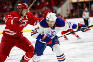 Edmonton Oilers defenseman Andrej Sekera (2) and Carolina Hurricanes center Eric Staal (12) during the NHL game between the Edmonton Oilers and the Carolina Hurricanes at the PNC Arena.