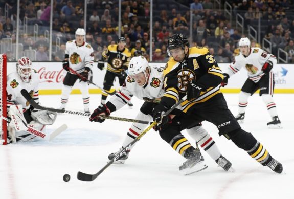 Boston Bruins Patrice Bergeron Chicago Blackhawks Adam Boqvist