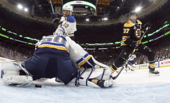 St. Louis Blues Jordan Binnington Boston Bruins' Patrice Bergeron