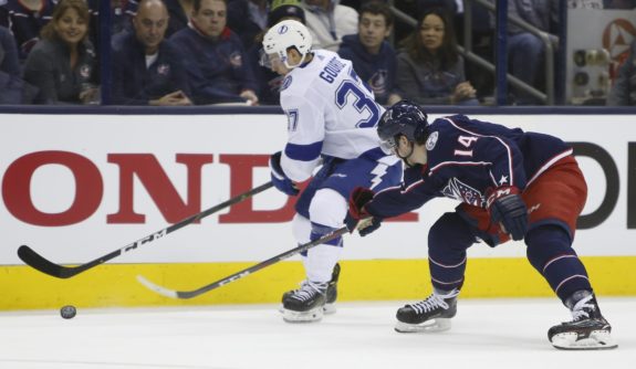 Tampa Bay Lightning's Yanni Gourde Columbus Blue Jackets' Dean Kukan