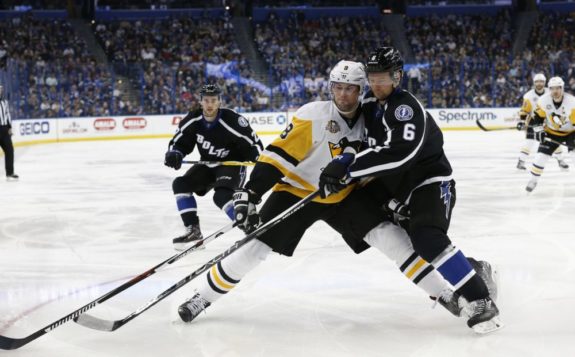 Brian Dumoulin of the Pittsburgh Penguins against Anton Stralman of the Lightning