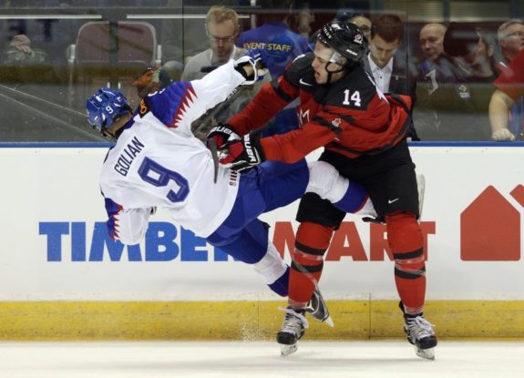 Anaheim Ducks prospect Maxime Comtois checks Team Slovakia's Andrej Golian