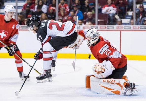 Canada's Barrett Hayton Switzerland goalie Akira Schmid