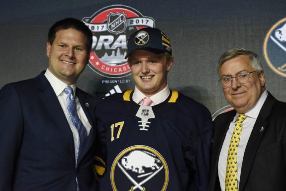 Casey Mittlestadt with Jason Botterill and Terry Pegula.