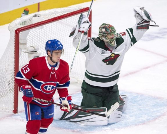 Minnesota Wild goalie Devan Dubnyk and Montreal Canadiens forward Max Domi 