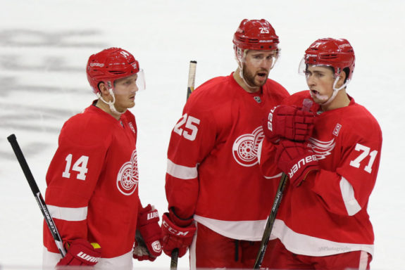 Gustav Nyquist, Mike Green, and Dylan Larkin of the Detroit Red Wings