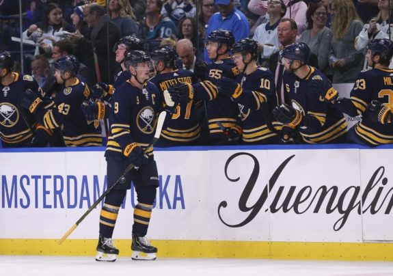 Jack Eichel celebrating with bench.