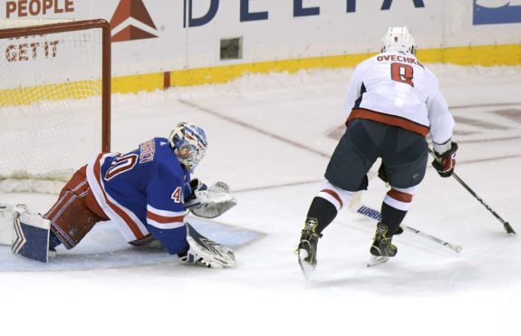 Washington Capitals Alex Ovechkin skates in against New York Rangers Alexandar Georgiev
