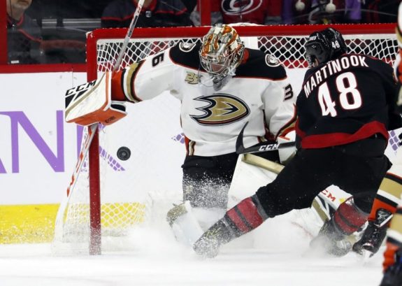 Carolina Hurricanes' Jordan Martinook has his shot blocked by Anaheim Ducks goaltender John Gibson