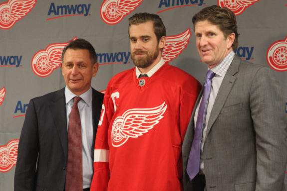 Ken Holland, Henrik Zetterberg and coach Mike Babcock of the Detroit Red Wings.