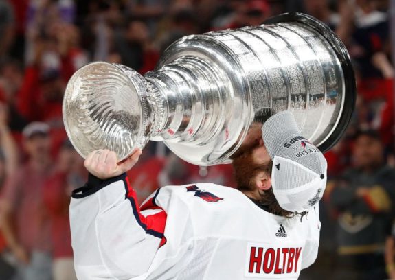 Braden Holtby #70 of the Washington Capitals kisses the Stanley Cup