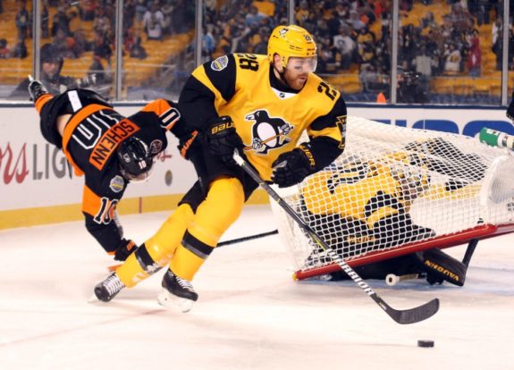 Ian Cole with the puck