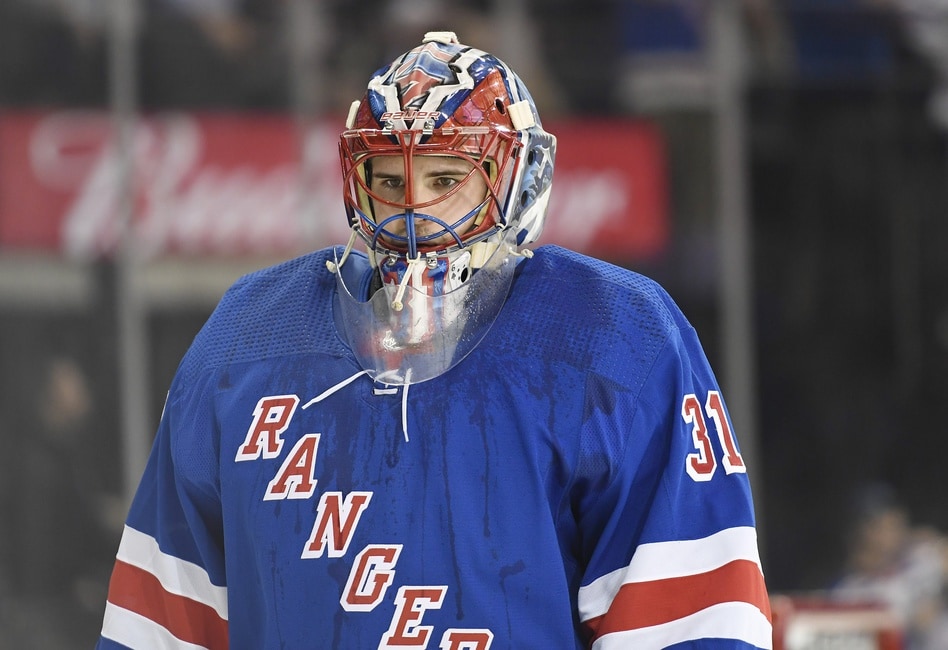 Igor Shesterkin of the New York Rangers stretches during the game