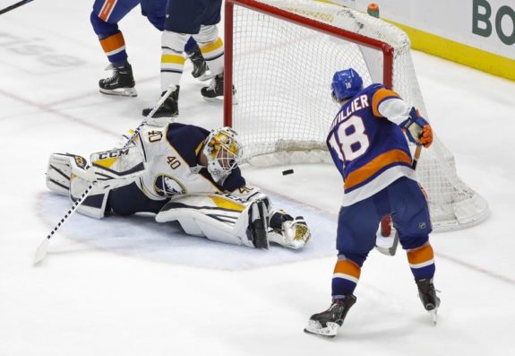 New York Islanders' Anthony Beauvillier Buffalo Sabres' Carter Hutton