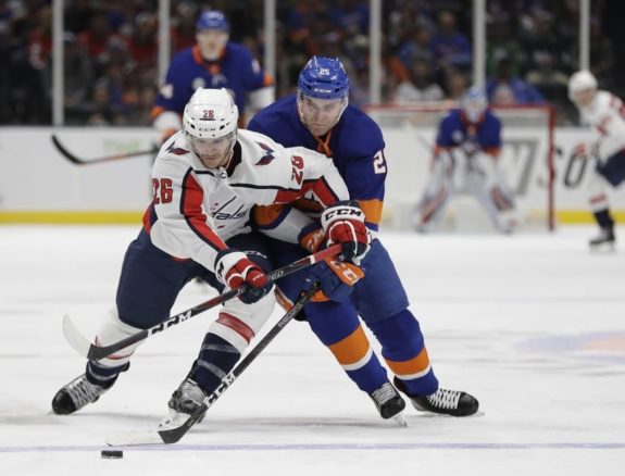 Washington Capitals' Nic Dowd New York Islanders' Devon Toews