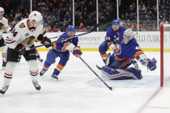 Chicago Blackhawks' Dominik Kahun New York Islanders Robin Lehner