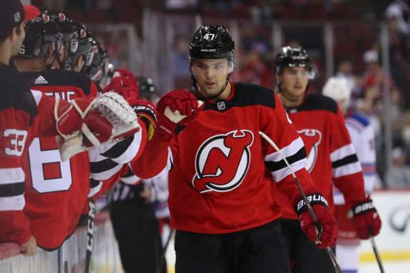 Devils left wing John Quenneville