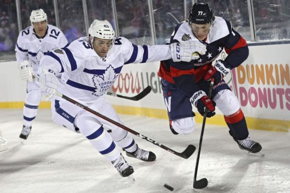 T.J. Oshie #77 of the Washington Capitals skates past Nazem Kadri