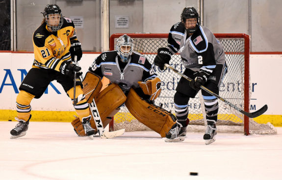 Brianne McLaughlin of the Buffalo Beauts has eyes on the puck in Game 1 of the Isobel Cup Final as Hilary Knight of the Boston Pride and Paige Harrington look on. (Photo Credit: Troy Parla)