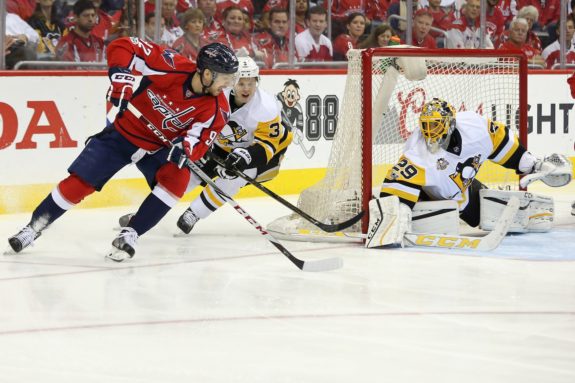 Olli Maatta defending against Washington's Evgeny Kuznetsov