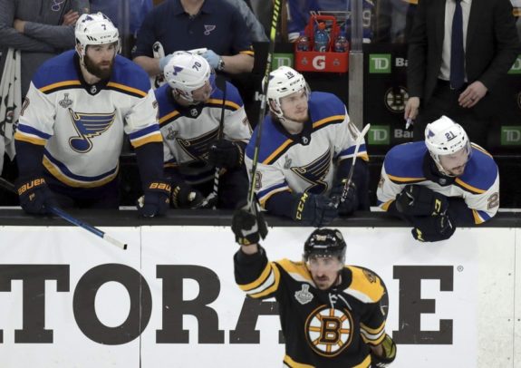 St. Louis Blues players on the bench Boston Bruins' Brad Marchand