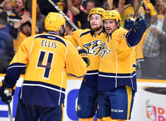 Filip Forsberg celebrates with defenseman Roman Josi, defenseman Ryan Ellis