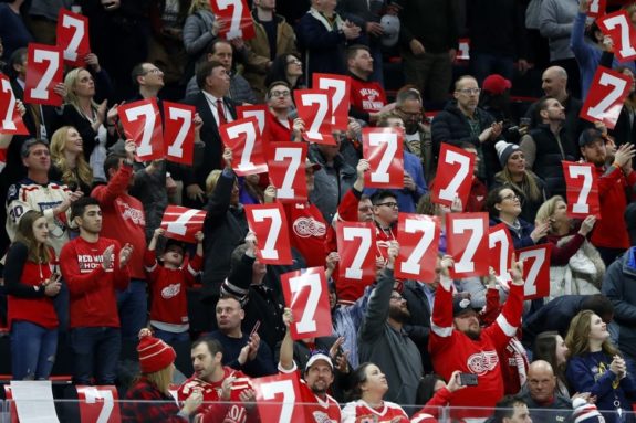 Detroit Red Wings fans hold up the No. 7 in honor of former player Ted Lindsay