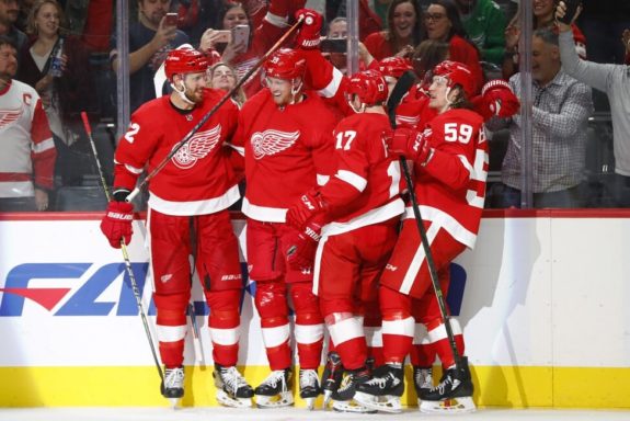 Detroit Red Wings skaters Anthony Mantha, Tyler Bertuzzi, and Filip Hronek.