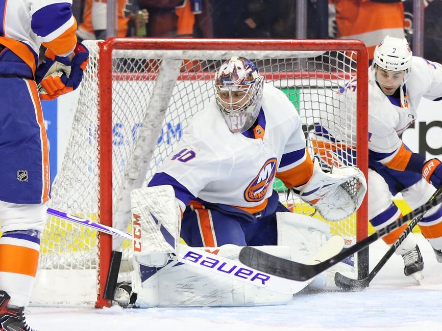 New York Islanders' Semyon Varlamov, left, blocks a shot by Philadelphia  Flyers' Cam York during the second period of a preseason NHL hockey game,  Thursday, Oct. 5, 2023, in Philadelphia. (AP Photo/Matt