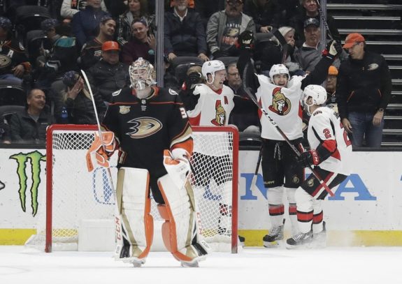 Ottawa Senators' Colin White Dylan DeMelo and Mark Stone Anaheim Ducks John Gibson