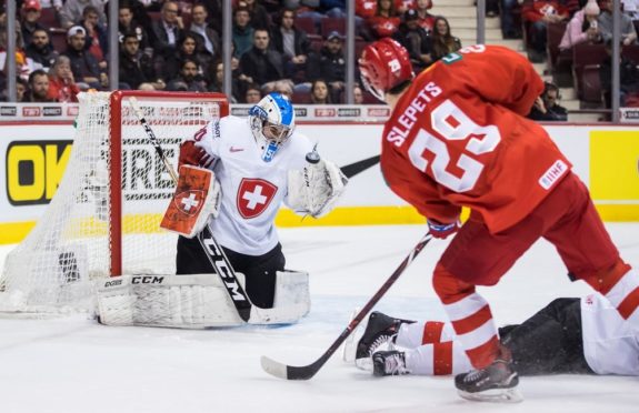 Switzerland goalie Luca Hollenstein Russia's Kirill Slepets-IIHF Needs to Let New Countries Host World Junior Championship