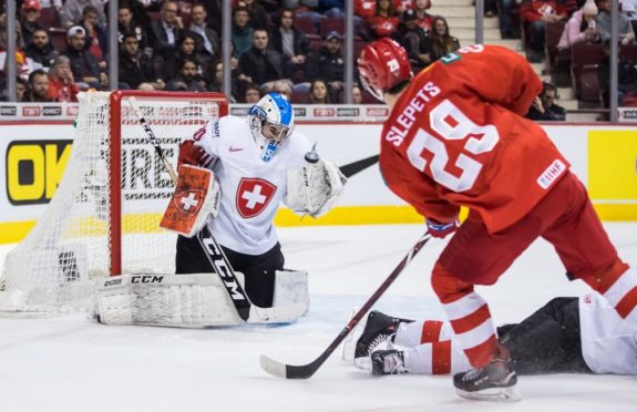 Switzerland goalie Luca Hollenstein Russia's Kirill Slepets