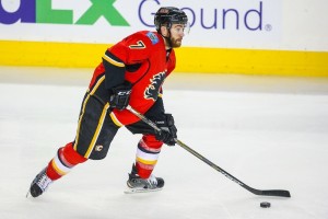 Apr 25, 2015; Calgary, Alberta, CAN; Calgary Flames defenseman T.J. Brodie (7) controls the puck against the Vancouver Canucks during the first period in game six of the first round of the 2015 Stanley Cup Playoffs at Scotiabank Saddledome. Calgary Flames won 7-4. Mandatory Credit: Sergei Belski-USA TODAY Sports