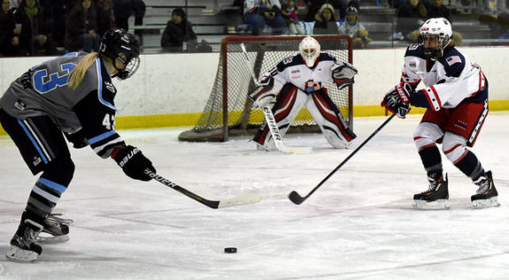 Tatiana Rafter of the Buffalo Beauts prepares to shoot against Jenny Scrivens of the New York Riveters as Elena Moore defends. (Troy Parla)