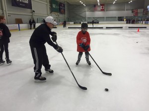 Flyers Youth Special Hockey Club player Tim takes instruction from Coach Zach. Photo courtesy of Mike Kehoe