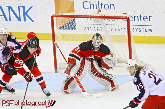 New Jersey Devils goalie Scott Wedgewood looks through traffic in his NHL debut, a 2-1 win over Columbus on March 20, 2016. (Paula Faerman Photography/paulafaermanphotography.org)