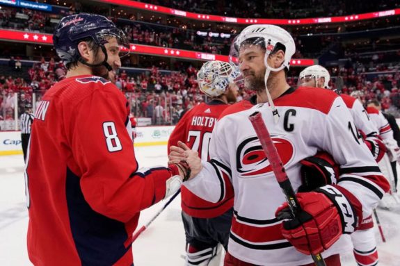 Alex Ovechkin #8 of the Washington Capitals and Justin Williams of the Carolina Hurricanes