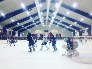 Andong Song (NYI/Phillips Andover) battles with Luke Stevens (CAR/Noble and Greenough)) in front of the Andover net