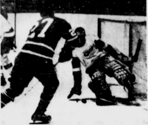 Roger Crozier makes one of his 38 saves last night on the Leafs' Frank Mahovlich.