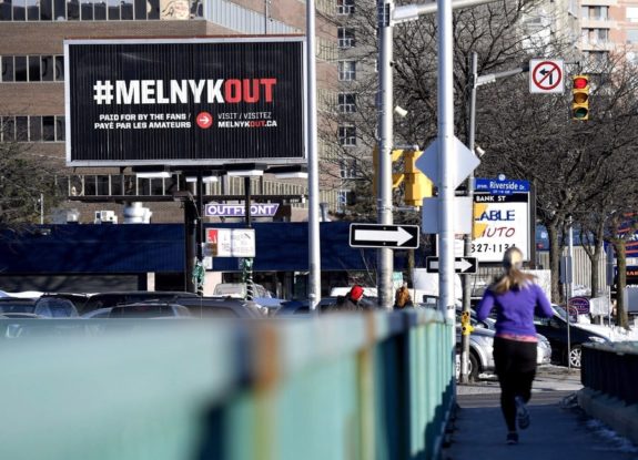 A billboard calling for Ottawa Senators owner Eugene Melnyk