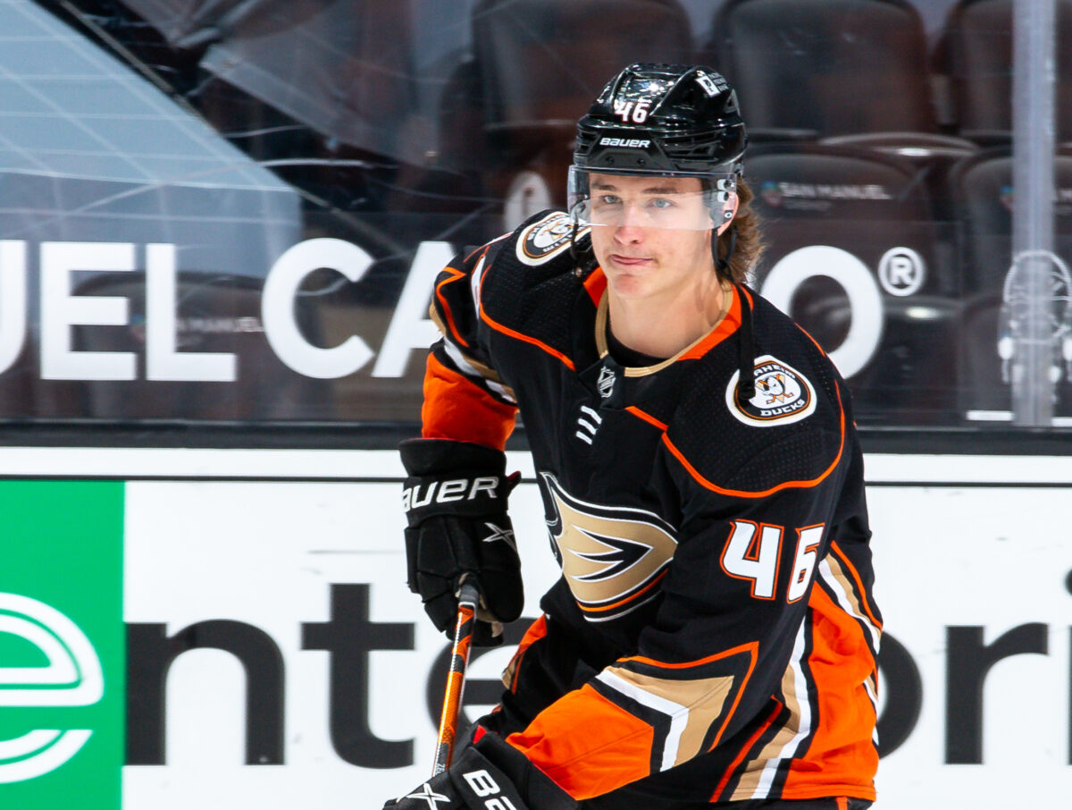 Anaheim Ducks center Trevor Zegras (11) controls the puck during the first  period of an NHL