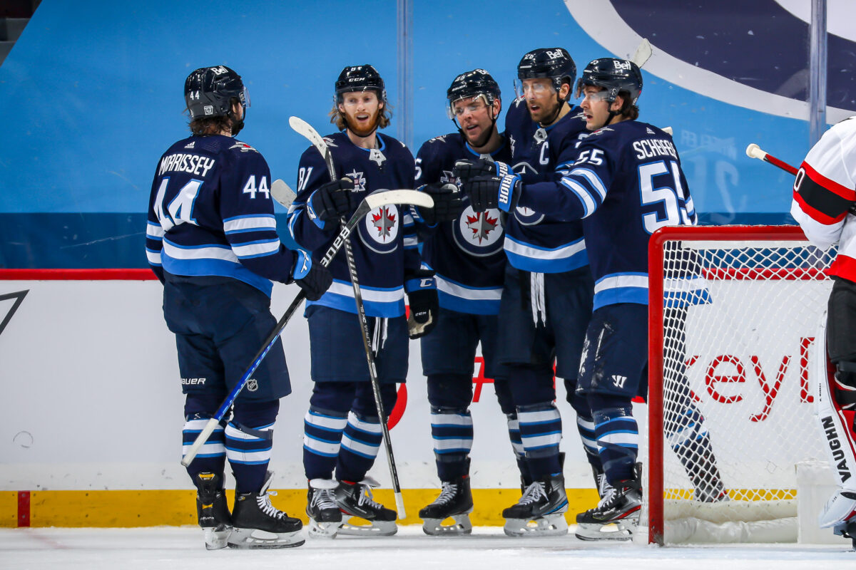 Winnipeg Jets Kyle Connor celebrates with Blake Wheeler, Mark Scheifele, Paul Stastny, and Josh Morrissey