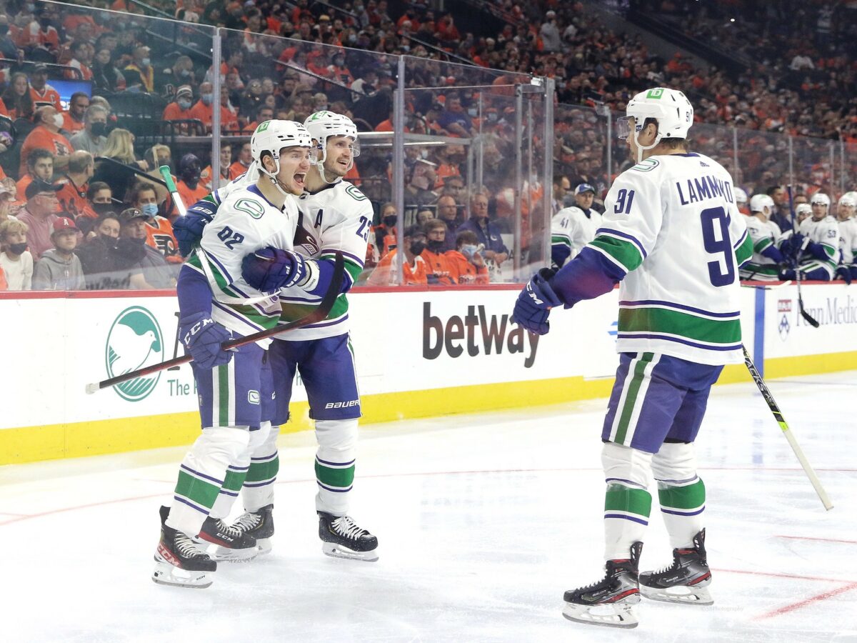 Vancouver Canucks Vasily Podkolzin, Oliver Ekman-Larsson and Juho Lammikko celebrate